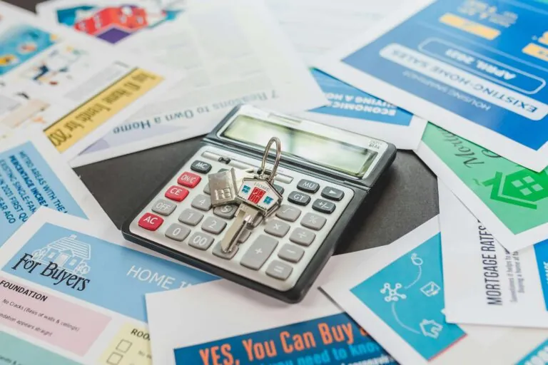 Property valuation calculations - an image showing different final charts with a calculator on top of the desk.